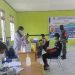 Personel TNI Dampingi Pelaksanaan Vaksinasi COVID-19 Untuk Warga Deiyai