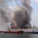 Petugas gabungan berupaya memadamkan KM Kirana I yang terbakar di perairan Semarang, Jawa Tengah, Minggu (11/8/2024)